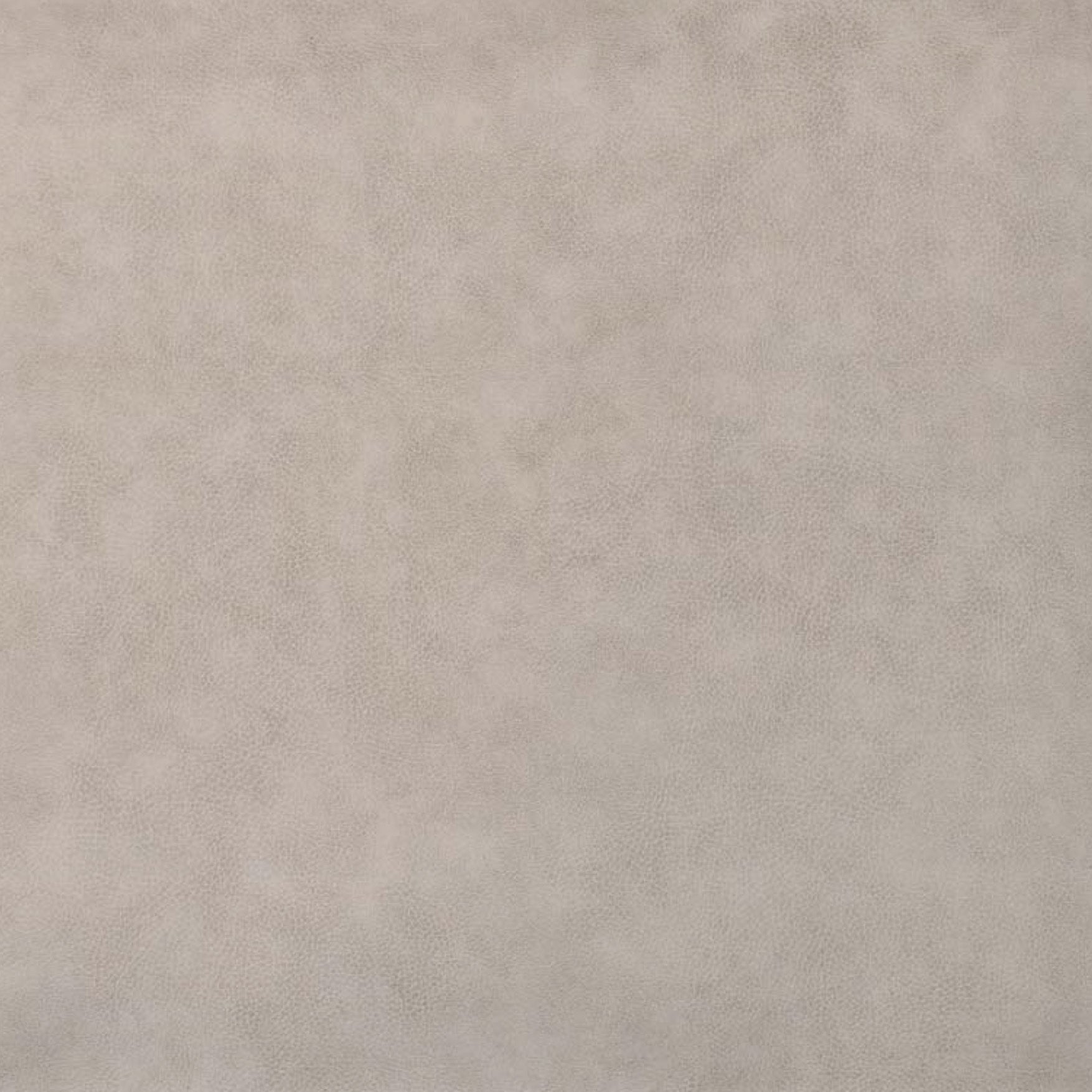 Eine Stoffprobe von der Manufaktur für Hunde. Das Stoffmuster hat die Farbe Kunstleder Grau