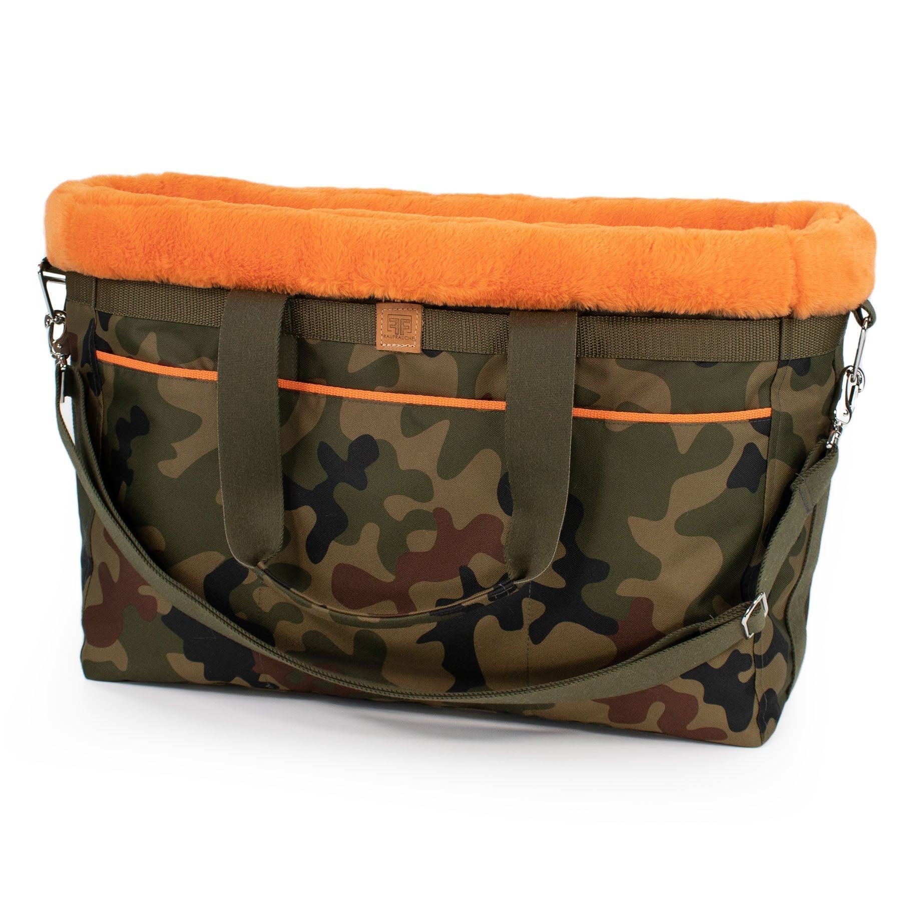 Eine Tragetasche in Camo-Orange für Hunde mit weicher Polsterung und Gurt, um es als Umhängetasche zu nutzen.
