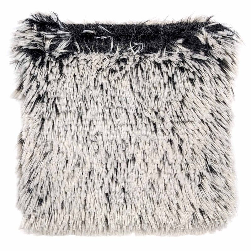 Eine Stoffprobe von der Manufaktur für Hunde. Das Stoffmuster hat die Farbe Zottel Schwarz Weiß